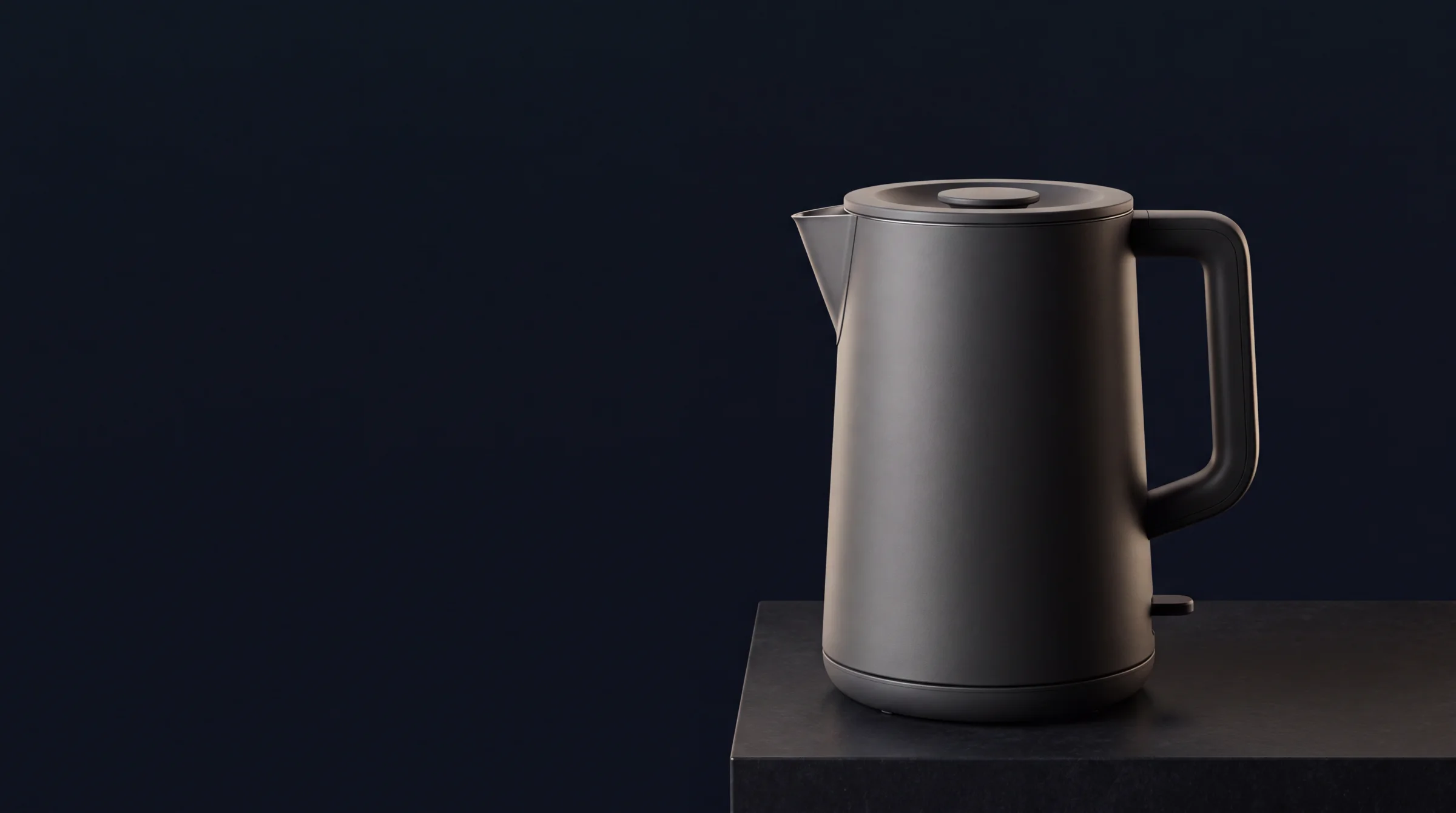 A graphite kettle shown across hero, detail, pouring and lifestyle compositions.